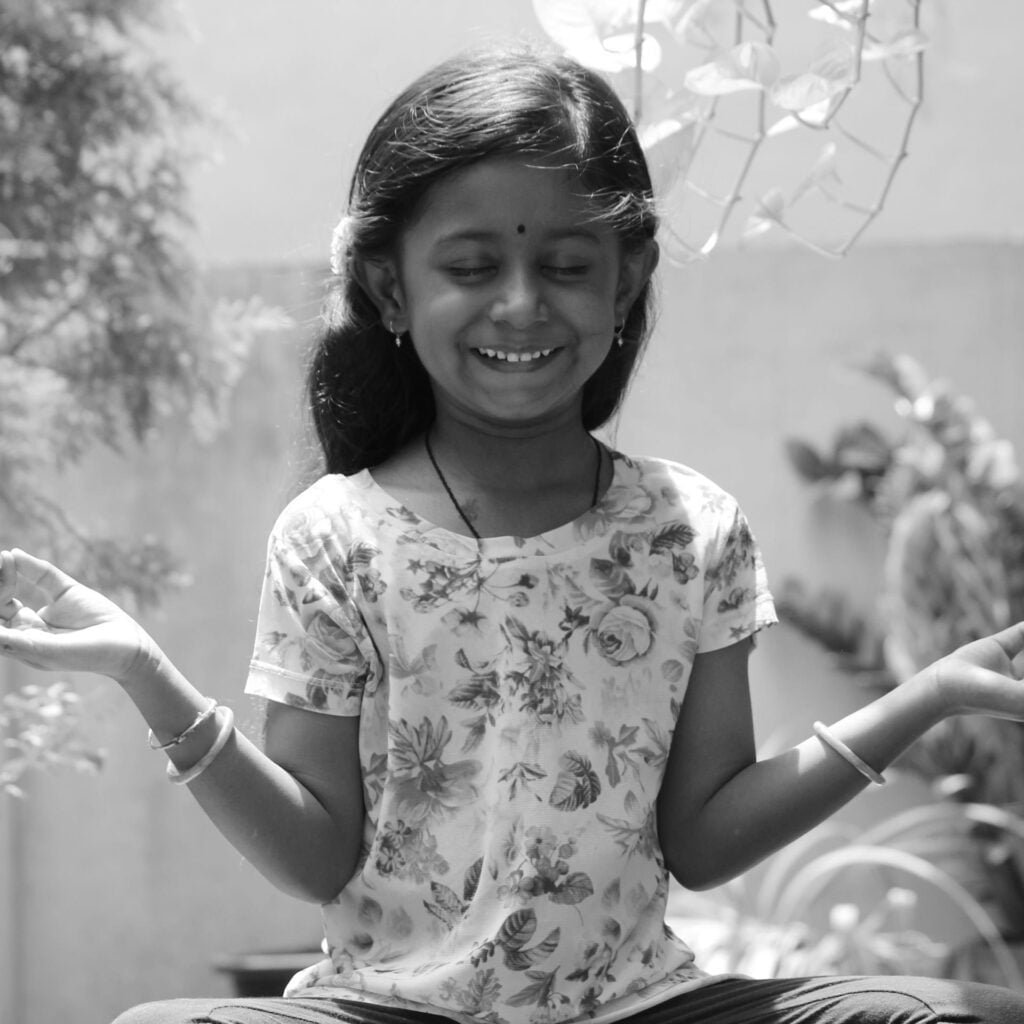 a girl doing yoga in silence